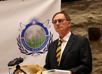 Ist mglicherweise ein Bild von 1 Person, steht und Text PEACE FEDERATION UPF 9ル